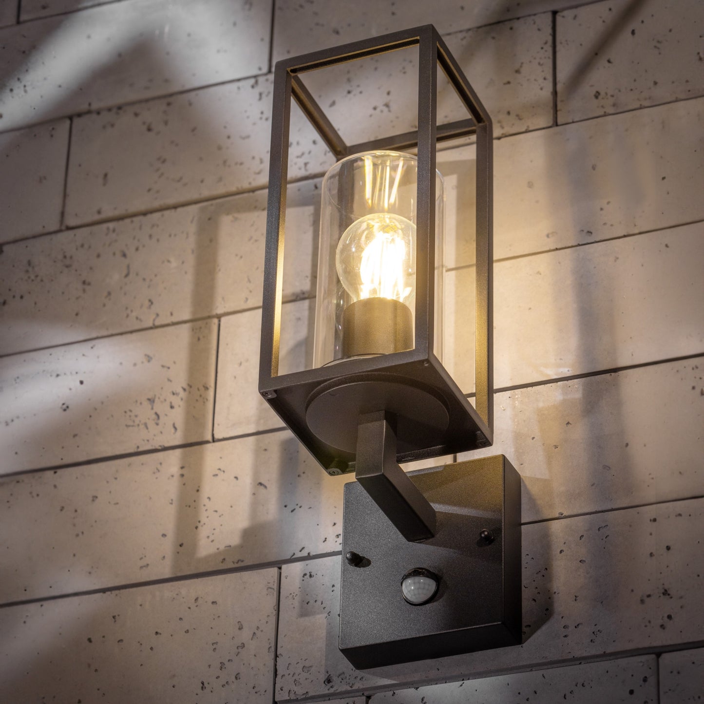 If you’re looking for a modern take on a traditional outdoor wall light, this black lantern wall light with clear diffuser is perfect for adding style and protection for your home. This classic design with a contemporary twist, styled with a metal lantern shape and fitted with a cylinder diffuser that allows the light to shine effectively