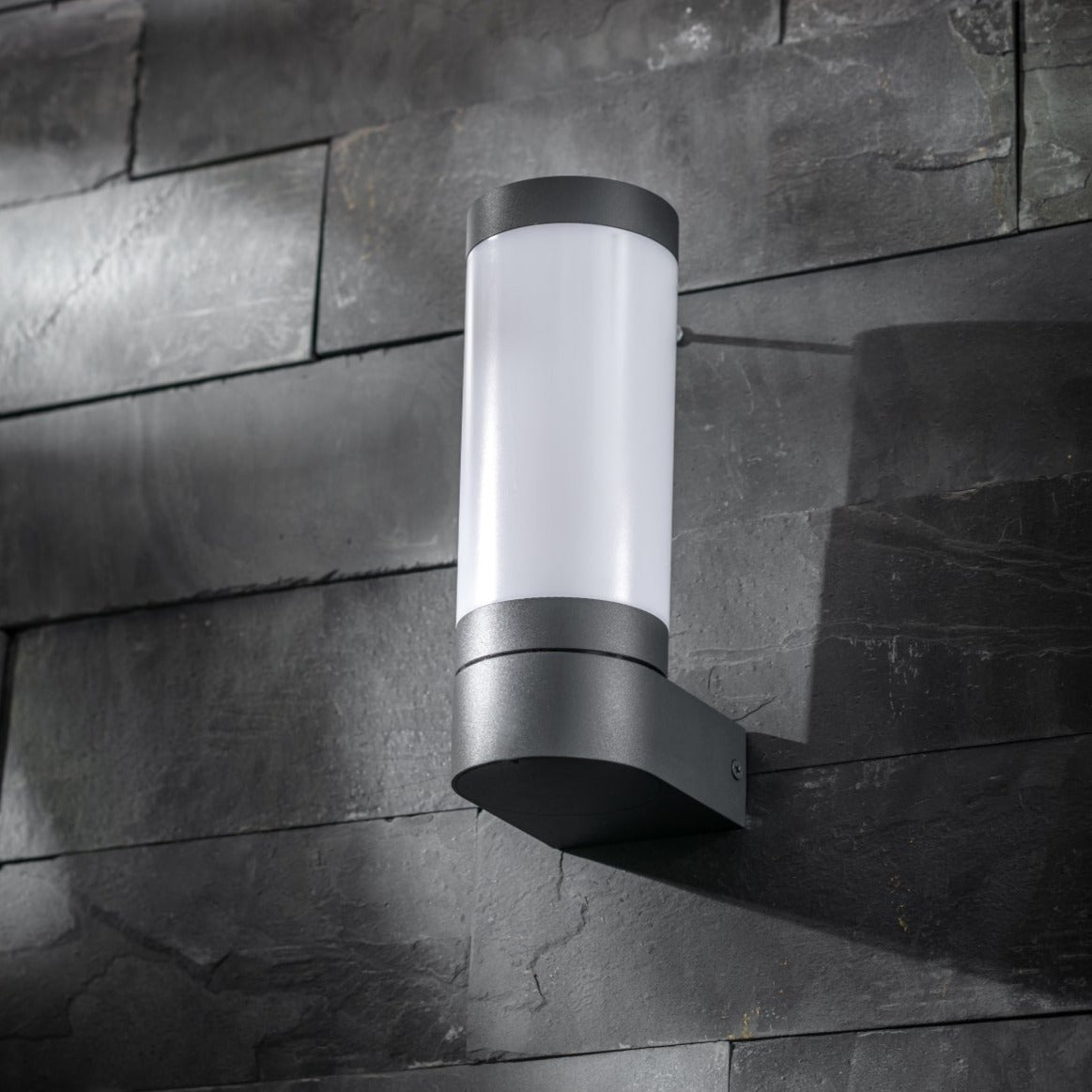 Our Rome grey anthracite outdoor wall light with opal diffuser would look perfect in a modern or more traditional home design. Outside wall lights can provide atmospheric light in your garden, at the front door or on the terrace as well as a great security solution. It is designed for durability and longevity with its robust material producing a fully weatherproof and water resistant light fitting.