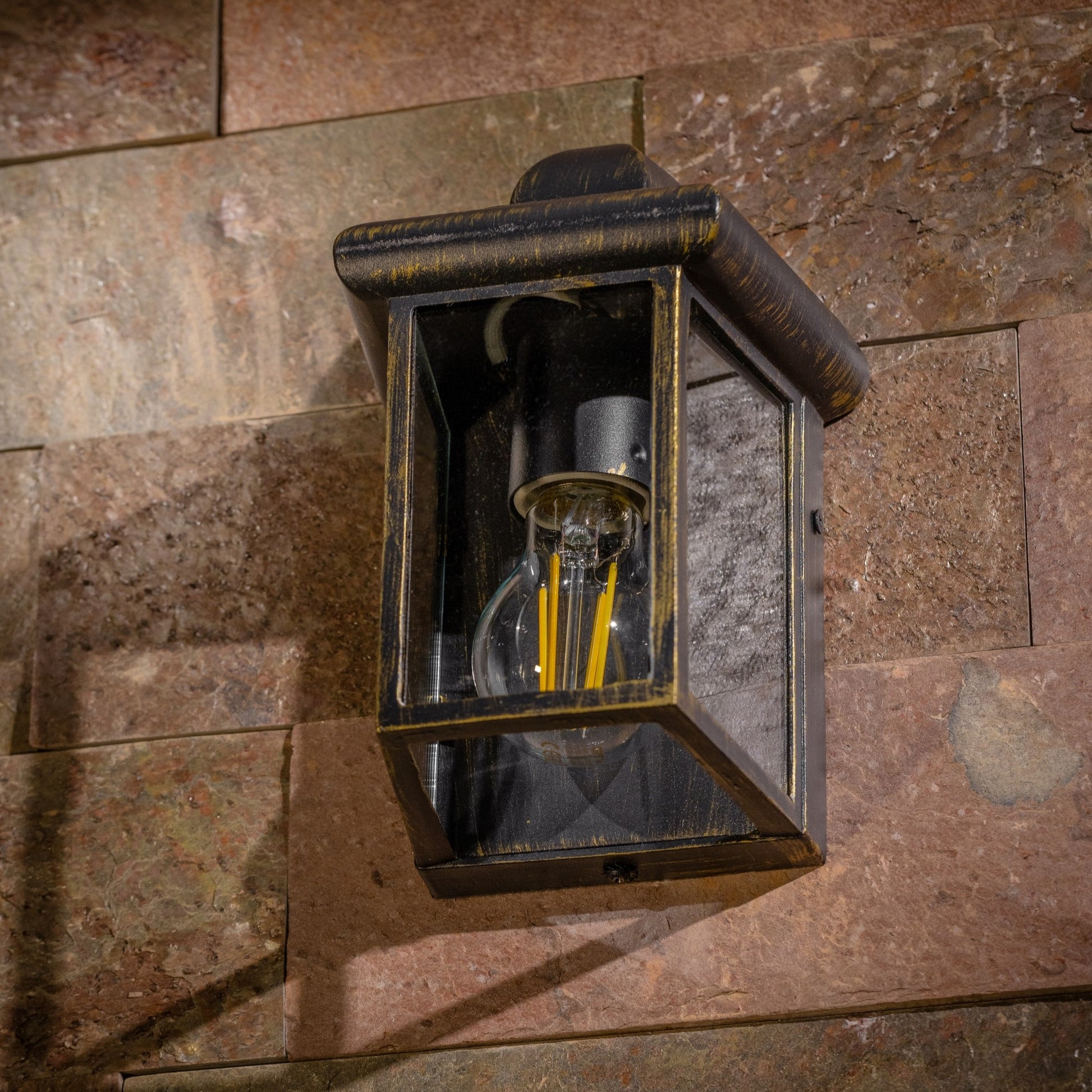 Our Camila wall lantern light is styled with a sophisticated black and bronze colour scheme, allowing the wall light to fit into any home’s style. What’s more, the lantern’s design is a modern take on a traditional styled wall light, creating a flexible look for interior and exterior use.&nbsp;