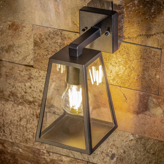 If you’re looking for a modern take on a traditional outdoor wall light, this black aluminium triangular wall light is perfect for adding style and protection for your home. This classic design with a contemporary twist, styled with a metal triangle shape and fitted with clear diffusers also contains an imposing black finish, making it ideal for any home design - adding a statement to any wall it fits in. Create an inviting glow over your garden and home with our Callie wall light by CGC Interiors.