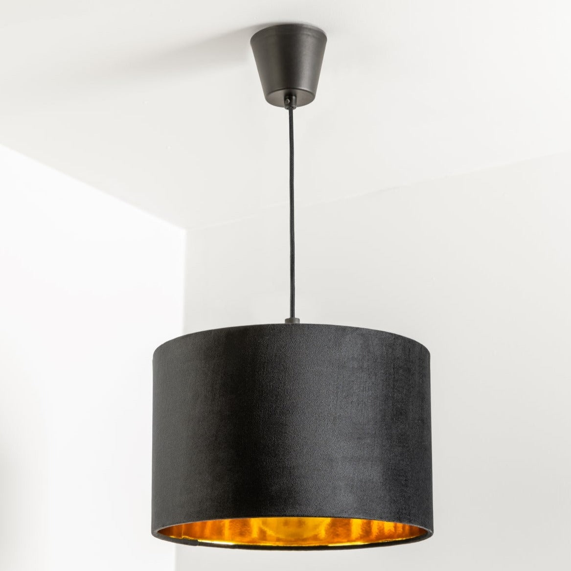 Our Nila velvet shade is sophisticated in appearance and we have designed the shade to  suit a range of interiors. Easy to fit, it’s crafted from high-quality velvet on the outer and has a reflective gold metallic inner. It's made to fit both a ceiling light or lamp base