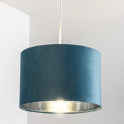 Our Nila velvet shade is sophisticated in appearance and we have designed the shade to  suit a range of interiors. Easy to fit, it’s crafted from high-quality velvet on the outer and has a reflective silver metallic inner. It's made to fit both a ceiling light or lamp base.