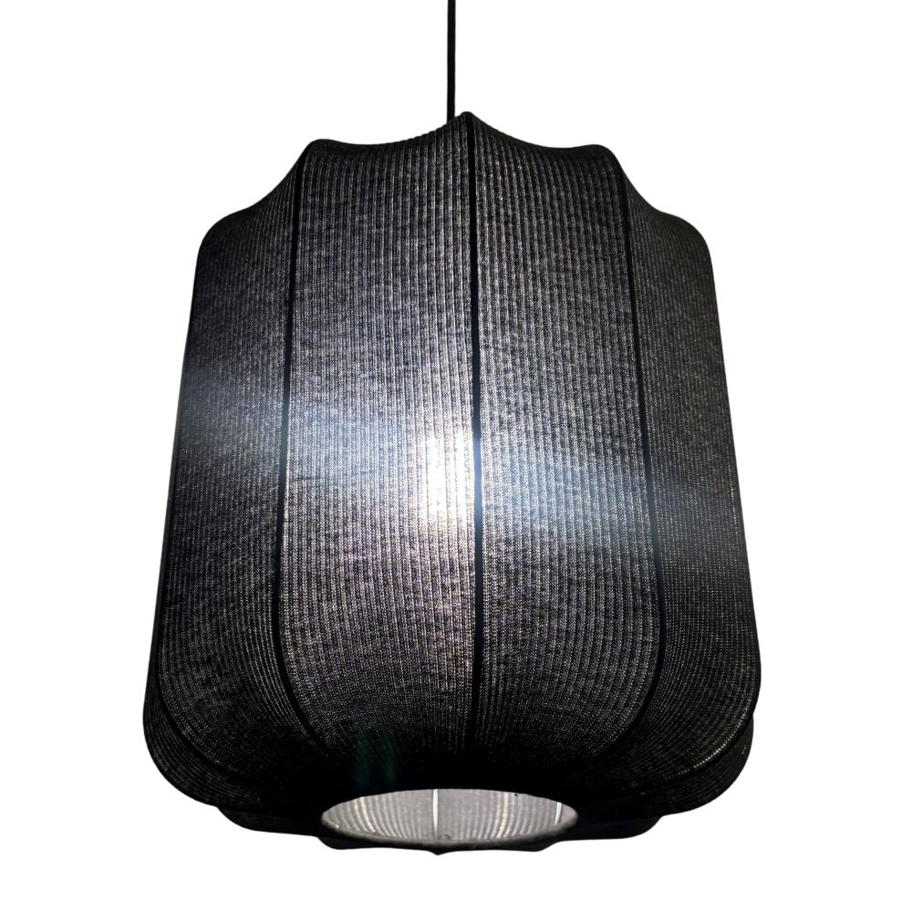 Black pendant lamp with textured shade on a white background