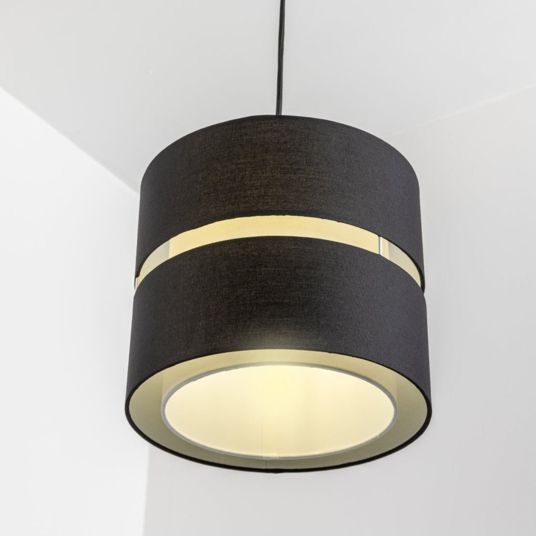 Our Gayle easy fit two tiered luxury fabric double layered shade is contemporary in its appearance and we have designed the shade to suit a range of interiors. Easy to fit simply attached to an existing pendant flitting.  It is crafted from high quality fabric material in two layers and complimented with a white inner which looks beautiful when light shines through