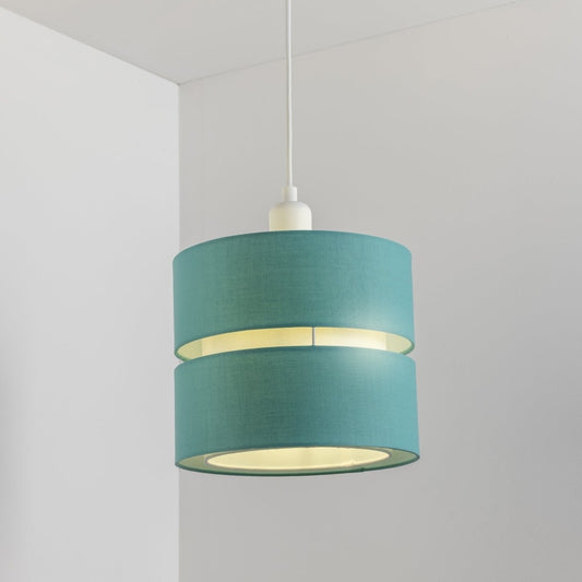 Our Gayle easy-fit two tiered luxury fabric double layered shade is contemporary in its appearance and we have designed the shade to suit a range of interiors. Easy to fit simply attached to an existing pendant flitting.  It is crafted from high quality fabric material in two layers and complimented with a white inner which looks beautiful when light shines through. The shade has been made to fit both a ceiling light or lamp base.