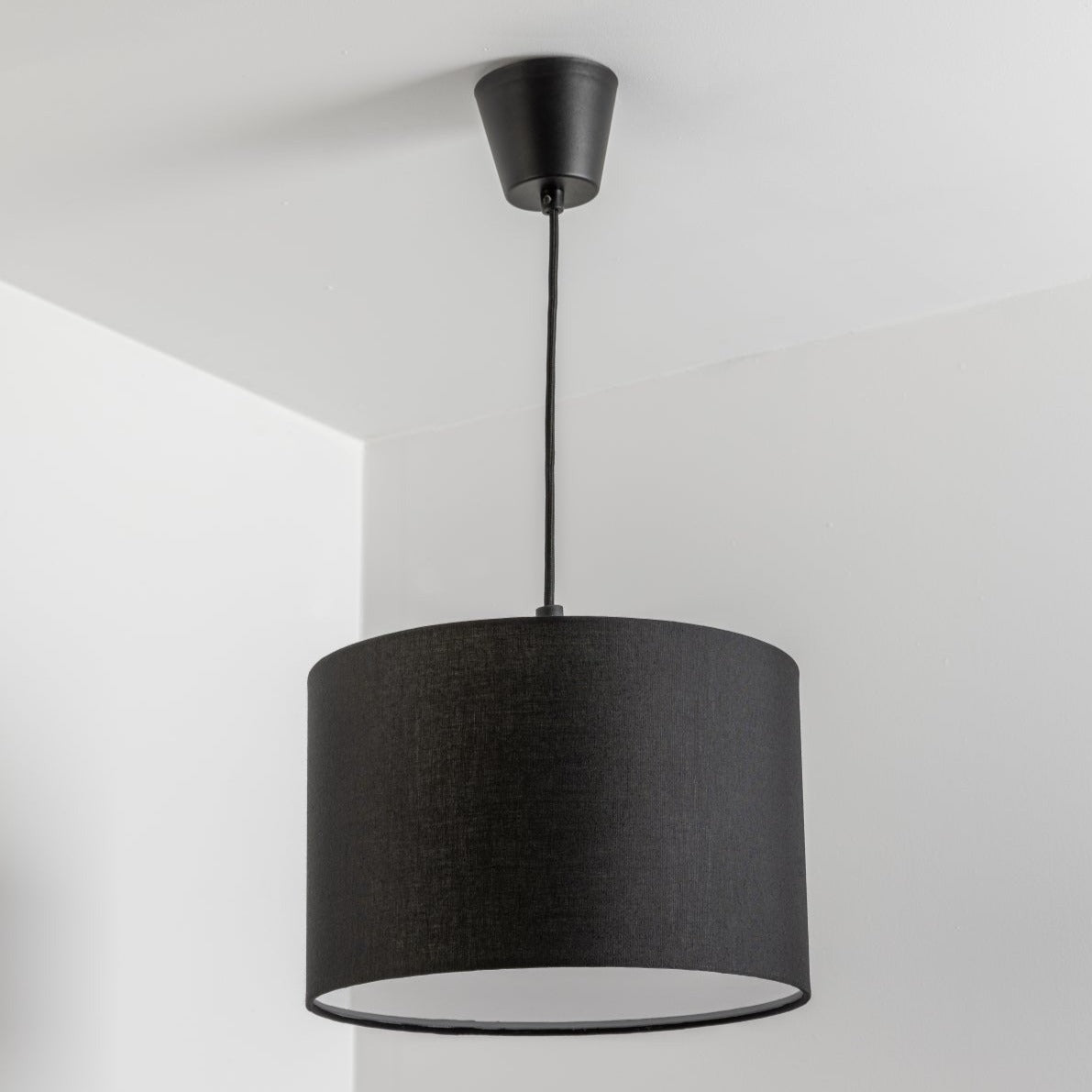The Lucia is a modern cylinder drum shaped lamp shade in a luxury cotton finish and white opal diffuser, which cleverly enhances the room instantly when illuminated providing a uniform light. This fantastic shade can double up as either a ceiling pendant light shade or table lampshade. Easily fits to your standard ceiling light socket - no wiring required.