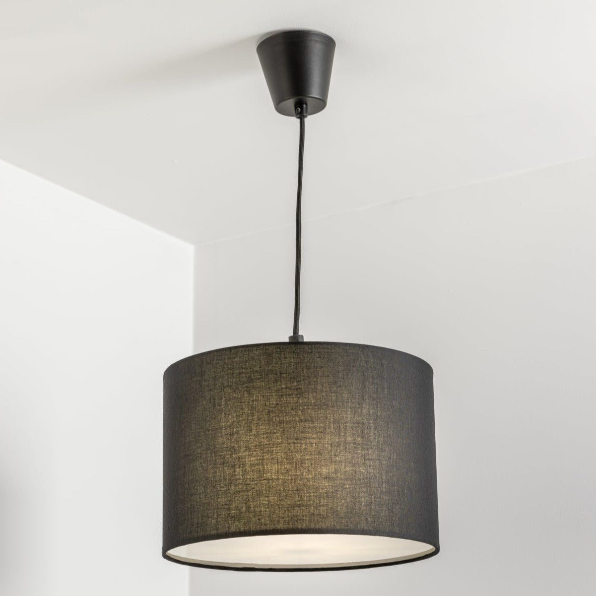 The Lucia is a modern cylinder drum shaped lamp shade in a luxury cotton finish and white opal diffuser, which cleverly enhances the room instantly when illuminated providing a uniform light. This fantastic shade can double up as either a ceiling pendant light shade or table lampshade. Easily fits to your standard ceiling light socket - no wiring required.