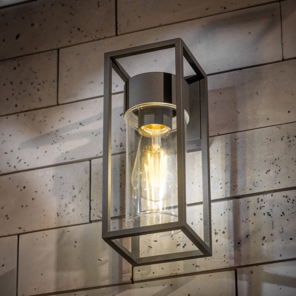 If you’re looking for a modern take on a traditional outdoor wall light, this anthracite wall light is perfect for adding style and protection for your home. This classic design with a contemporary twist, styled with a metal cuboid shape and fitted with a cylinder diffuser that allow the light to shine effectively. 