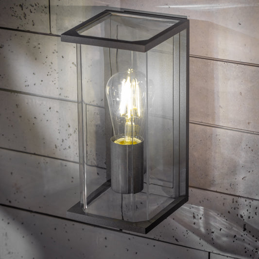 If you’re looking for a modern take on a traditional outdoor wall light, this dark grey lantern wall light with clear box diffuser is perfect for adding style and protection for your home. This classic design with a contemporary twist, styled with a metal lantern shape and fitted with a clear diffuser that allows the light to shine effectively. 