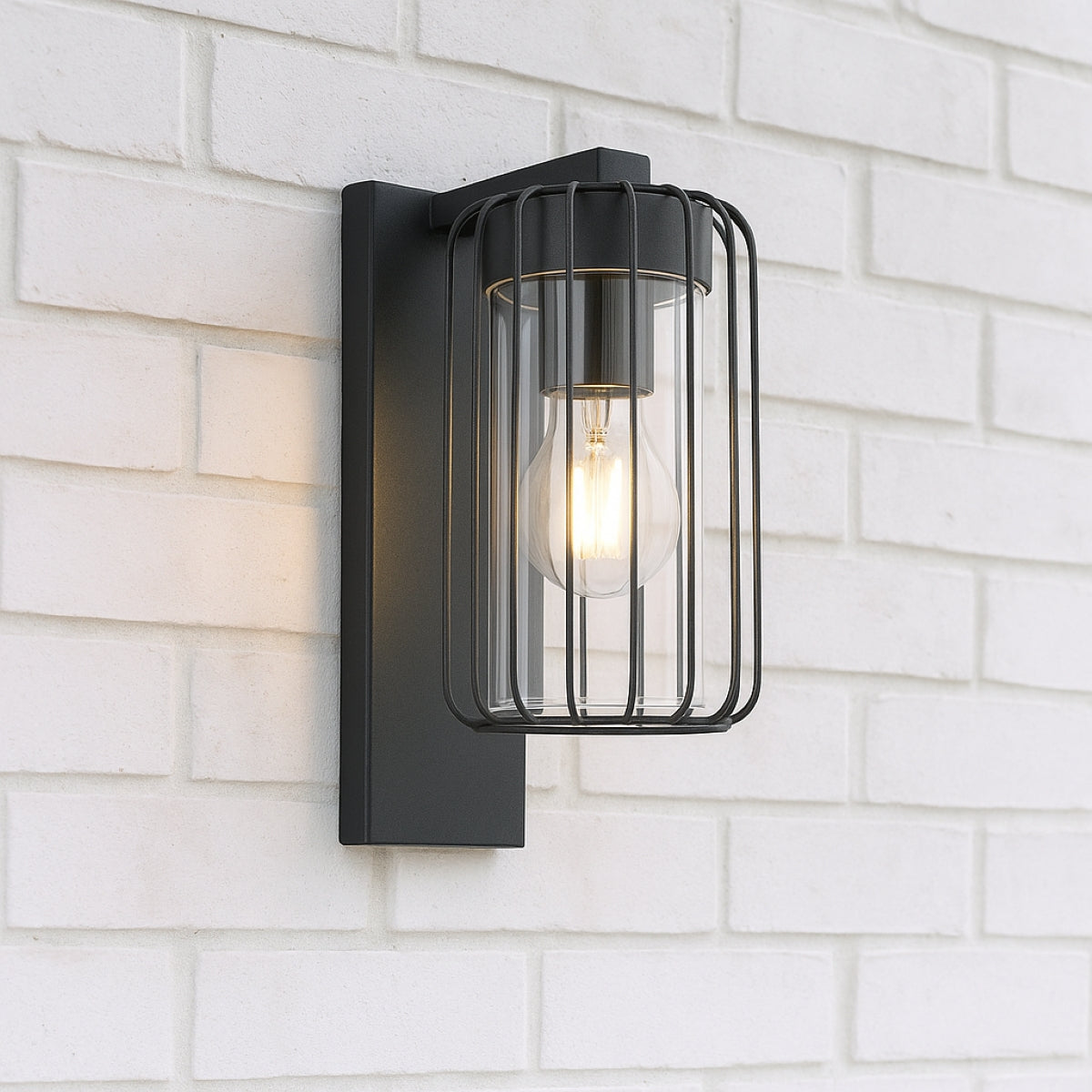 Black outdoor wall light fixture on a white brick wall