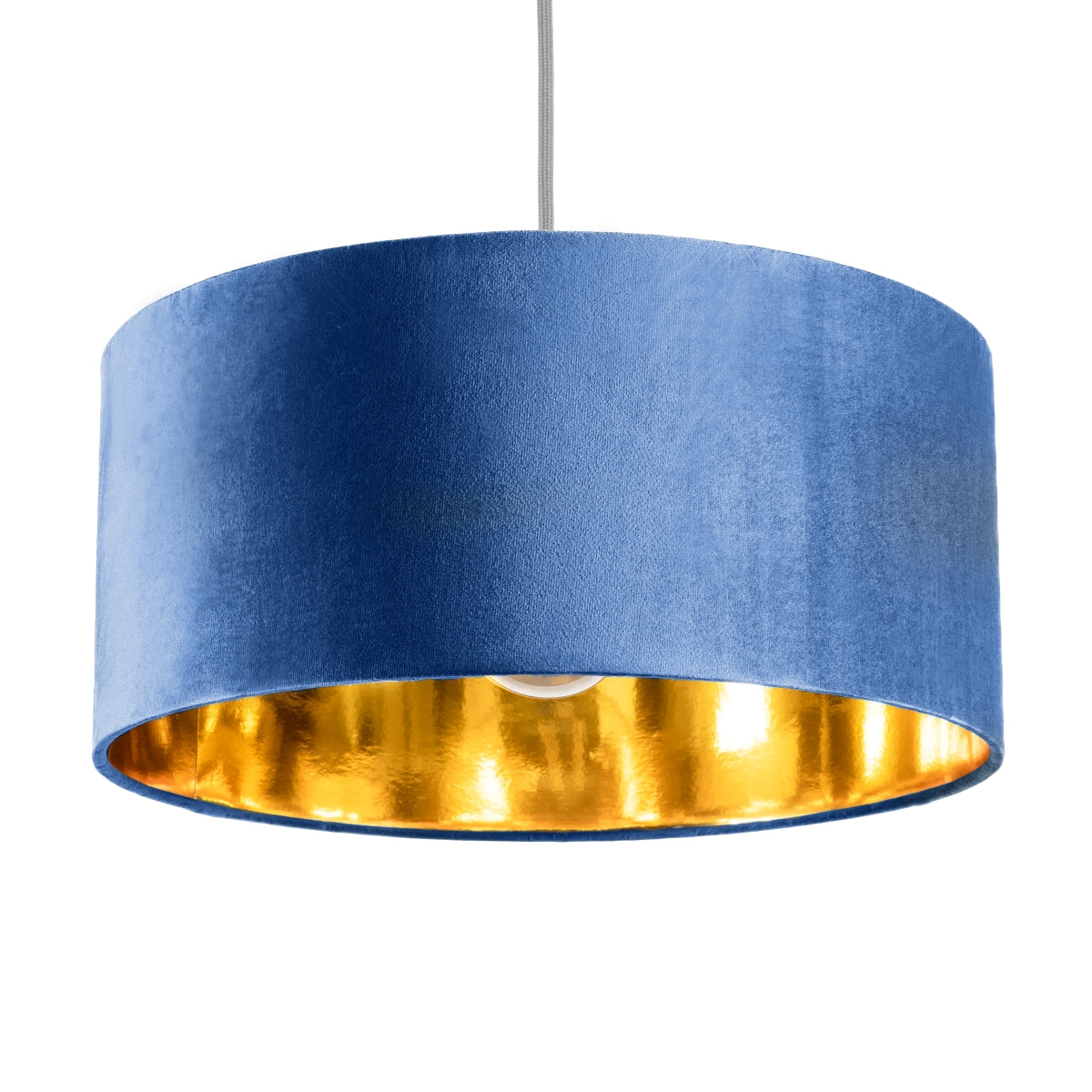 Our stunning oversized navy Milano lamp shade offers a timeless update to any room. The outer is made from high-quality navy blue velvet and the lining is reflective gold for a stylish finish. It’s easy to install and will instantly transforms your ceiling fitting, table or floor lamp. Simply attach to an existing light fitting or lamp base for an instant glow up.