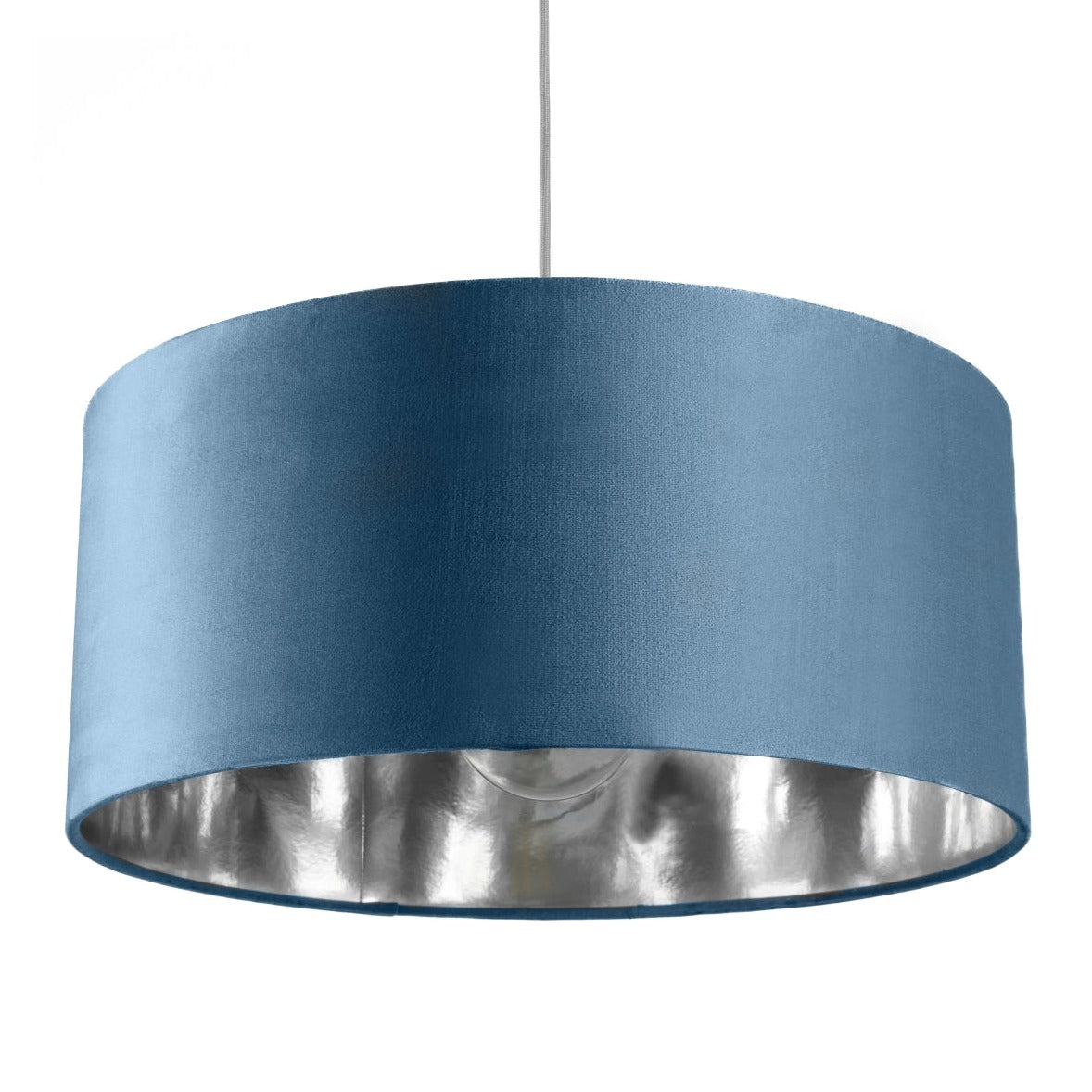 Our stunning oversized Teal blue/green Milano Lamp shade offers a timeless update to any room. The outer is made from high-quality velvet and the lining is reflective silver for a stylish finish. It’s easy to install and will instantly transforms your ceiling fitting, table or floor lamp.