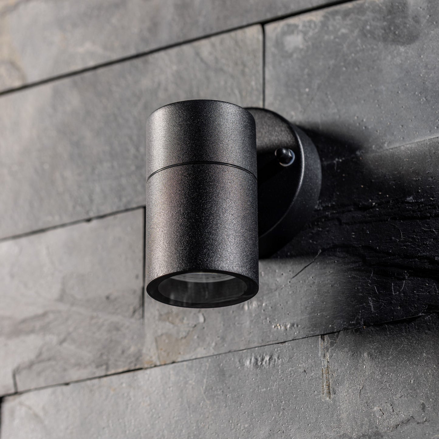 Our Leon outdoor single down light is modern and stylish in its appearance.  It comes in a cylinder design mounted on a circular back plate and clear glass diffuser. It is designed for durability and longevity with its robust material producing a fully weatherproof and water resistant light fitting