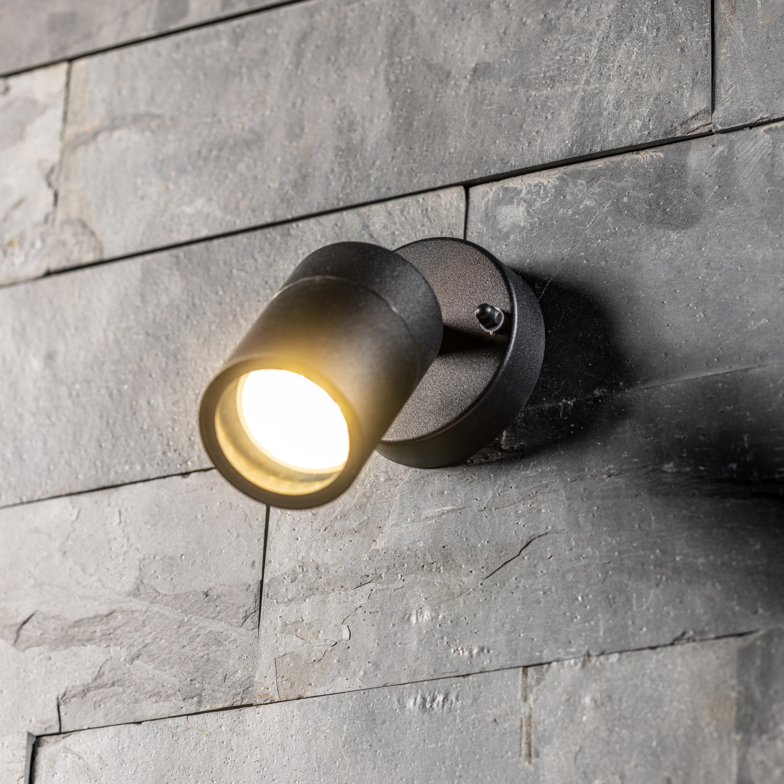 Our Leon outdoor single down light is modern and stylish in its appearance.  It comes in a adjustable cylinder design mounted on a circular back plate and clear glass diffuser. It is designed for durability and longevity with its robust material producing a fully weatherproof and water resistant light fitting