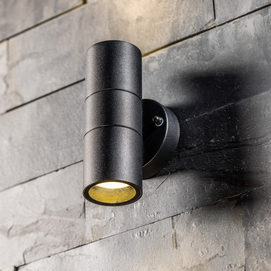  Our Leon outdoor up and down outdoor wall light is modern and stylish in its appearance.  It comes in a cylinder design mounted on a circular back plate and complete with clear glass diffusers. It is designed for durability and longevity with its robust material producing a fully weatherproof and water resistant light fitting