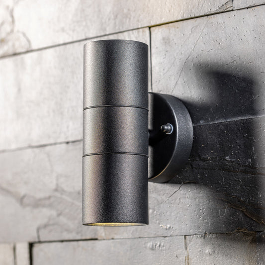 Our Mia outdoor up and down outdoor wall light is modern and stylish in its appearance.  It comes in a cylinder design mounted on a circular back plate and complete with clear glass diffusers. It is designed for durability and longevity with its robust material producing a fully weatherproof and water resistant light fitting