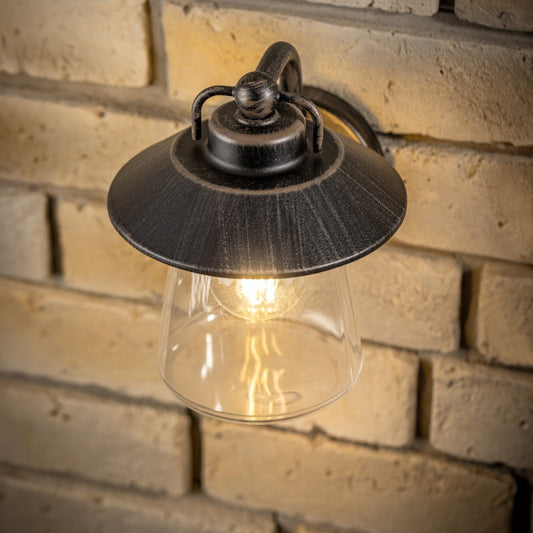 This wall lantern light is styled with a sophisticated black and bronze colour scheme, allowing the wall light to fit into any home’s style. What’s more, the lantern’s design is a modern take on a traditional styled wall light, creating a flexible look for interior and exterior use.
