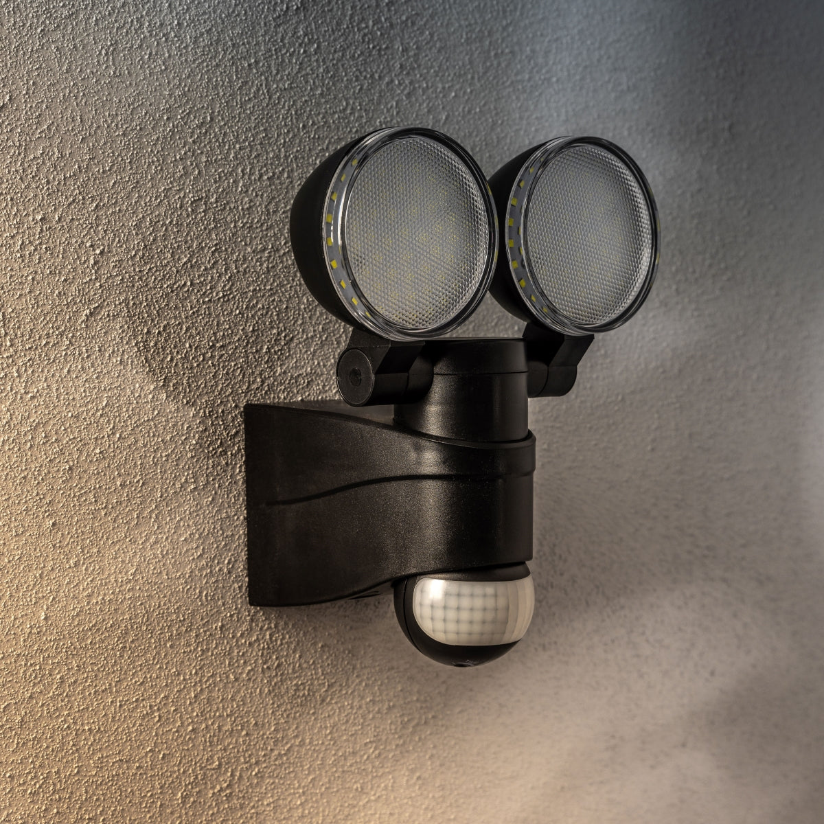 The Martha outdoor double spotlight is a stylish and fashionable outdoor solution for your home.  The easily adjustable heads of this outdoor wall lamp allow it to be used functionally for lighting paths and aesthetically decorate the walls of your home with a beautiful, bright glow. Made from polycarbonate making it rust proof. 