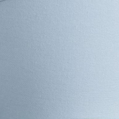 Close-up of a light blue lampshade on a white background