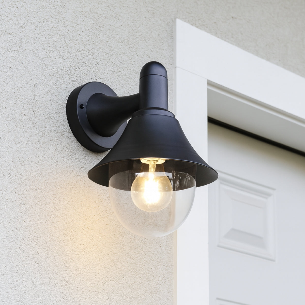 Black outdoor wall light fixture on a textured wall.