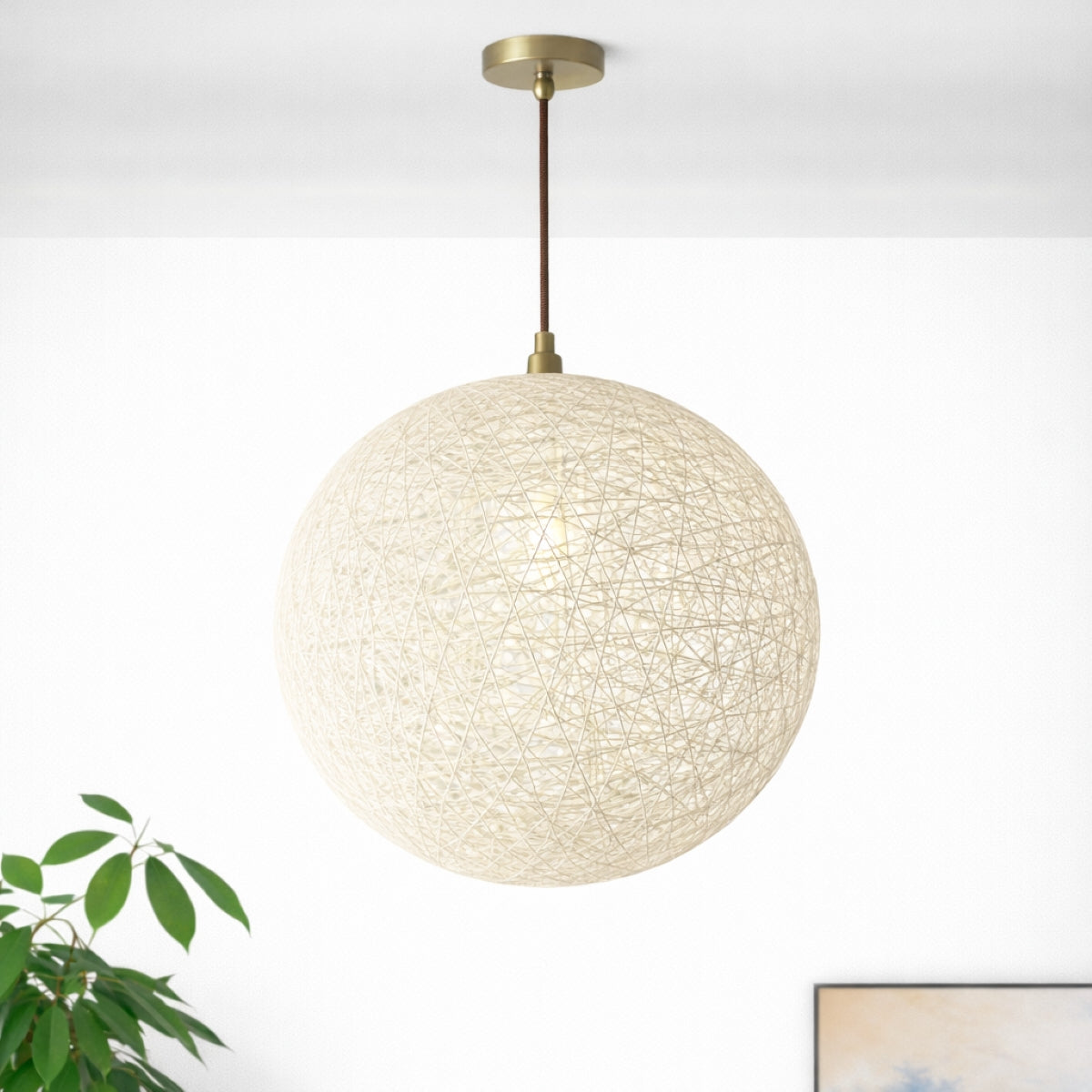 Spherical pendant light with textured design on a white background