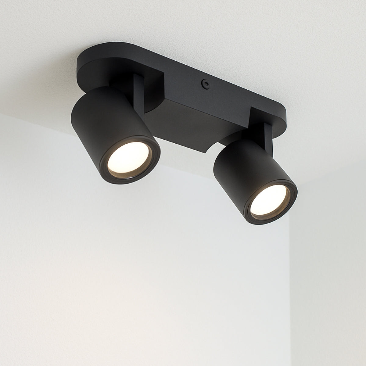 Black double-track ceiling light fixture on a white background