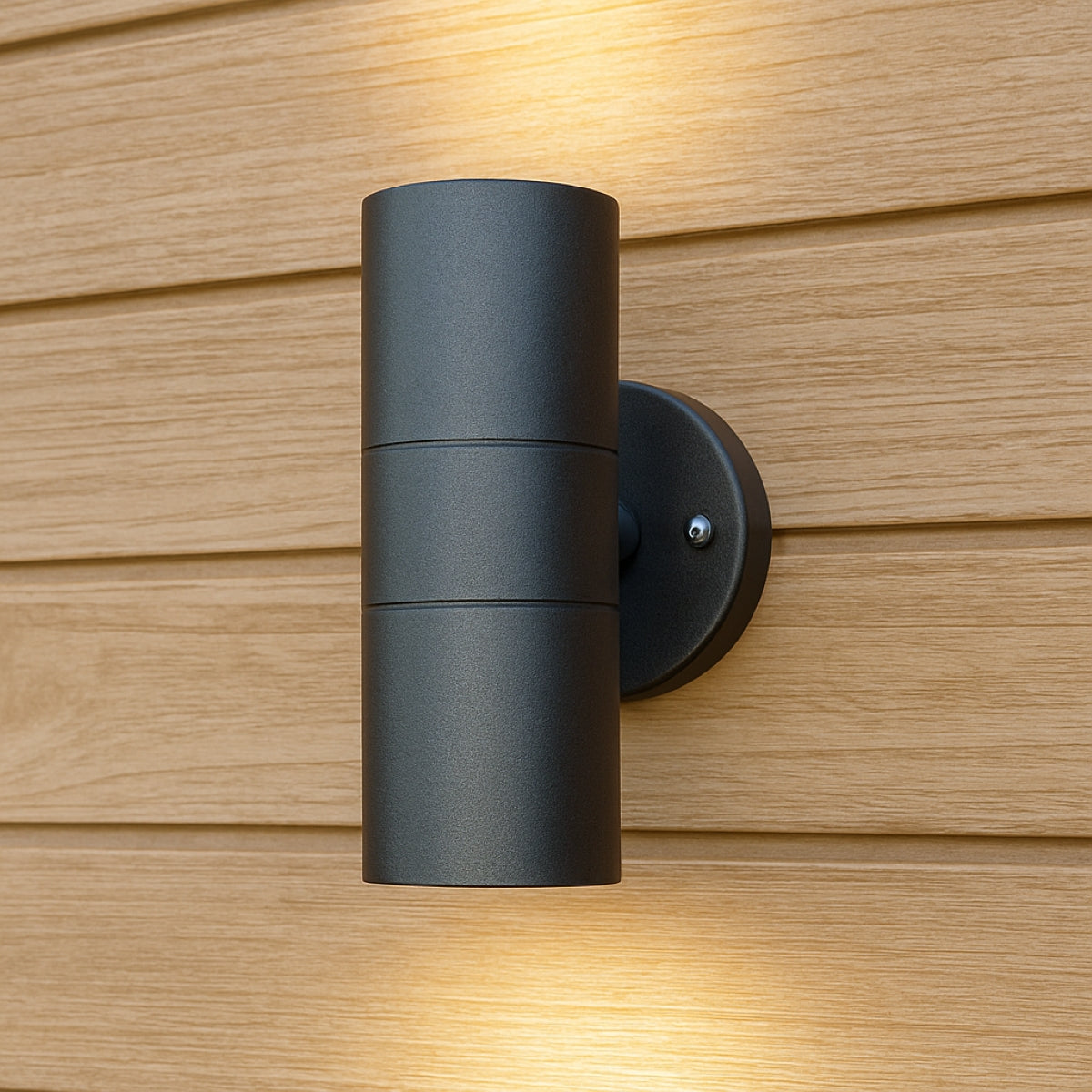 Black outdoor wall light fixture on a wooden wall