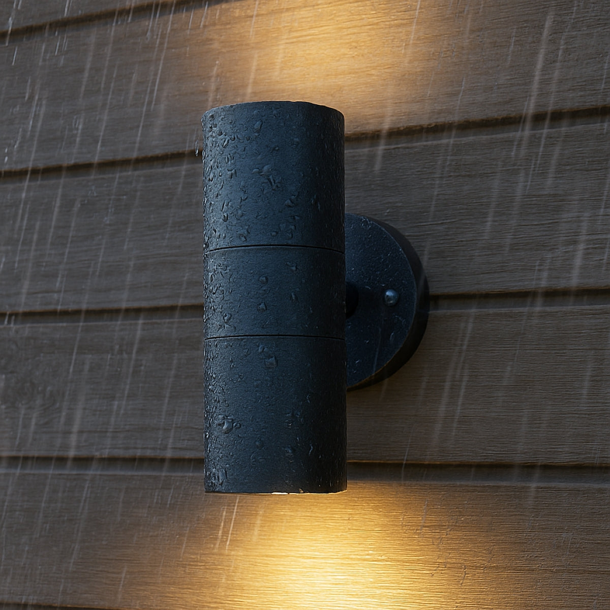 Black outdoor wall light fixture on a wooden wall