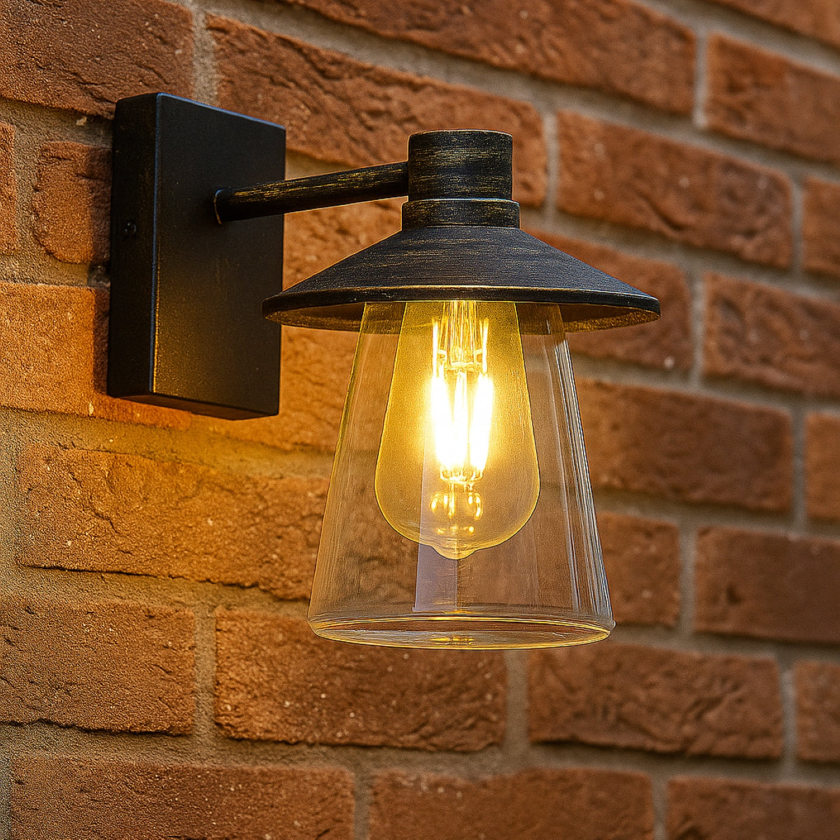 Wall-mounted outdoor light fixture on a brick wall
