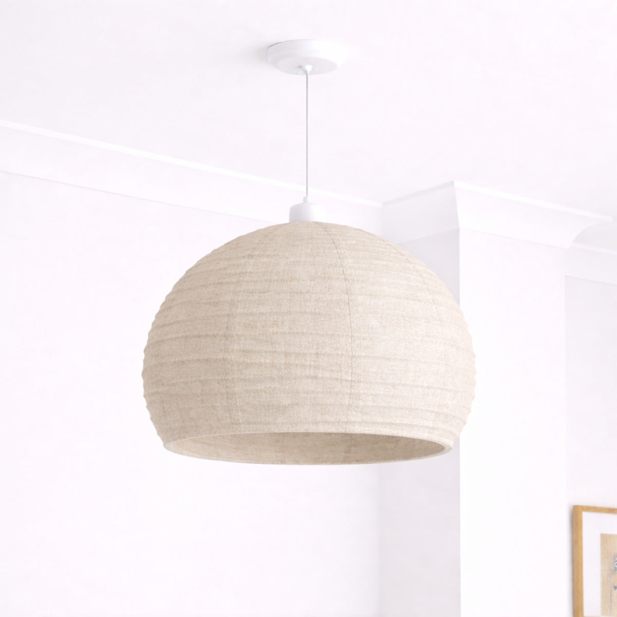 Beige pendant lamp hanging against a white background