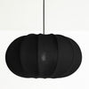 Black pendant lamp with a ribbed texture on a white background
