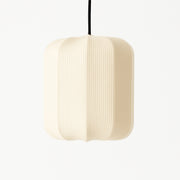 Beige pendant lamp with ribbed texture on a white background