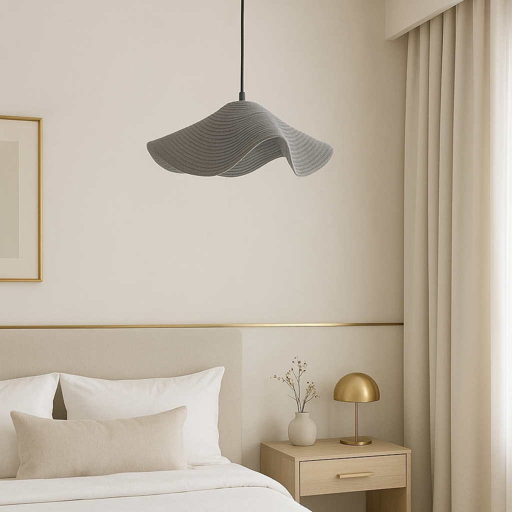 Modern bedroom with a bed, nightstand, and decorative elements.