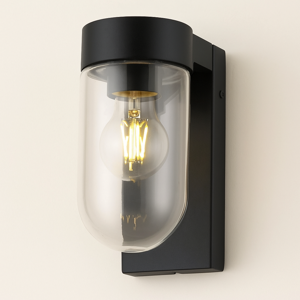 Black wall-mounted light fixture with a clear glass cover on a white background