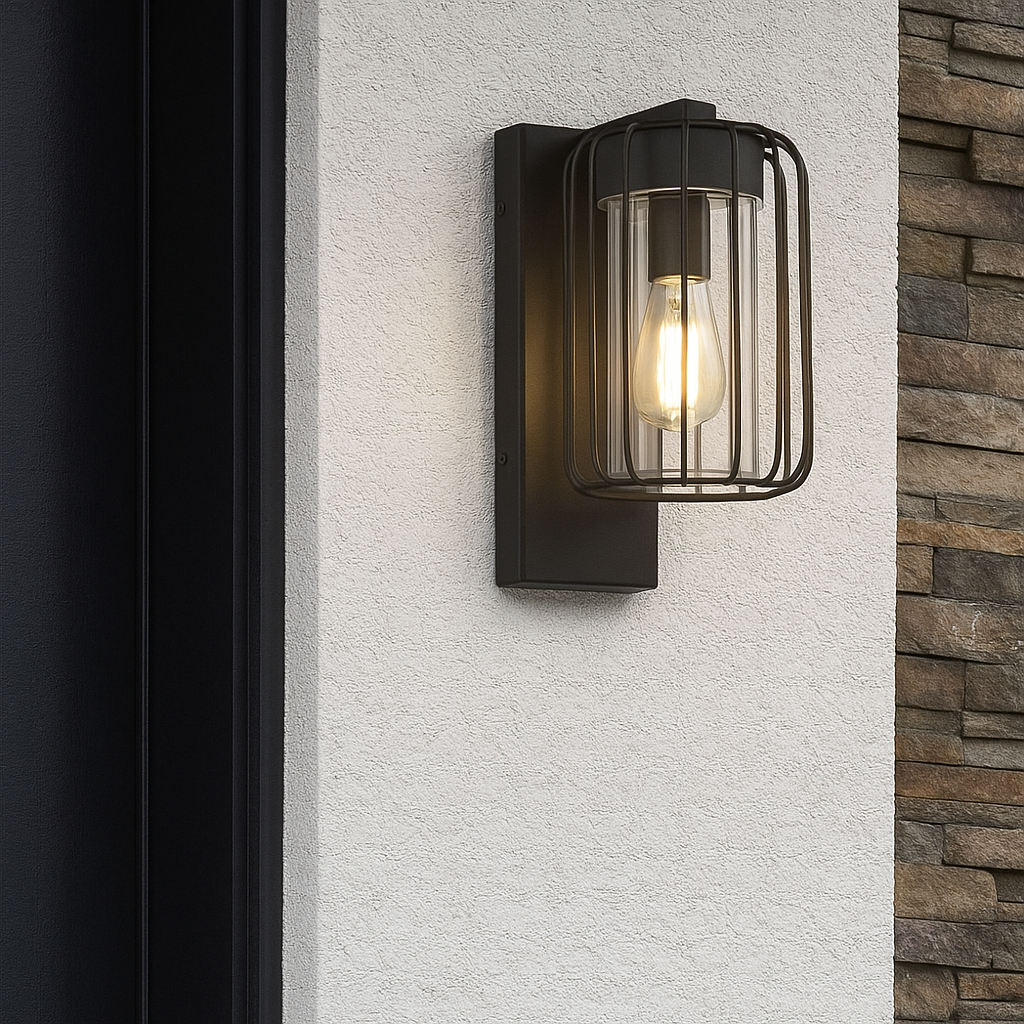 Black outdoor wall light fixture on a textured wall with stone wall background