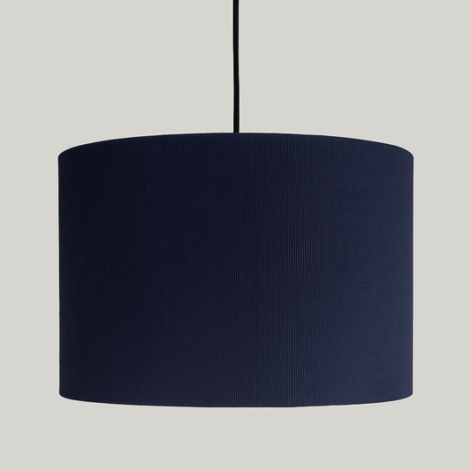 Navy blue lampshade on a plain background