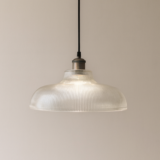 Pendant light with ribbed glass shade on a beige background