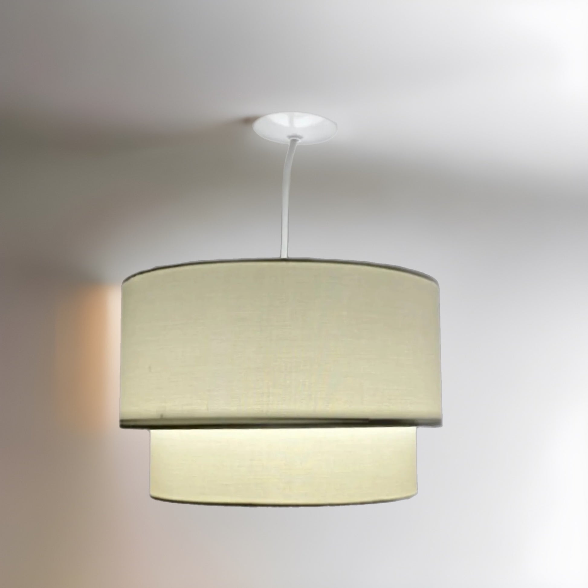 Our Kimber easy fit two tiered luxury fabric double layered shade is contemporary in its appearance and we have designed the shade to suit a range of interiors. Easy to fit simply attached to an existing pendant flitting.  It is crafted from high quality fabric material in two layers and complimented with a white inner