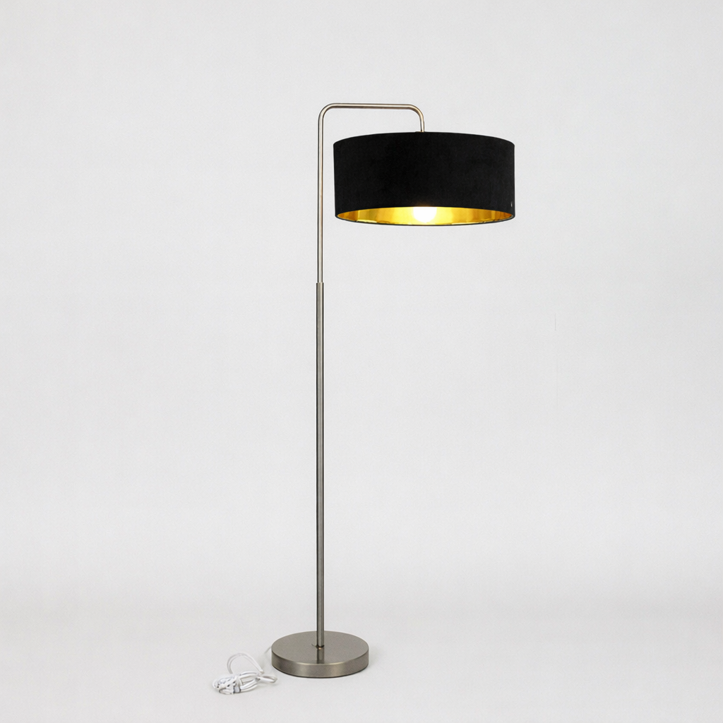 Floor lamp with black shade and gold interior on a white background