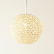 Pendant light with textured shade on a plain background
