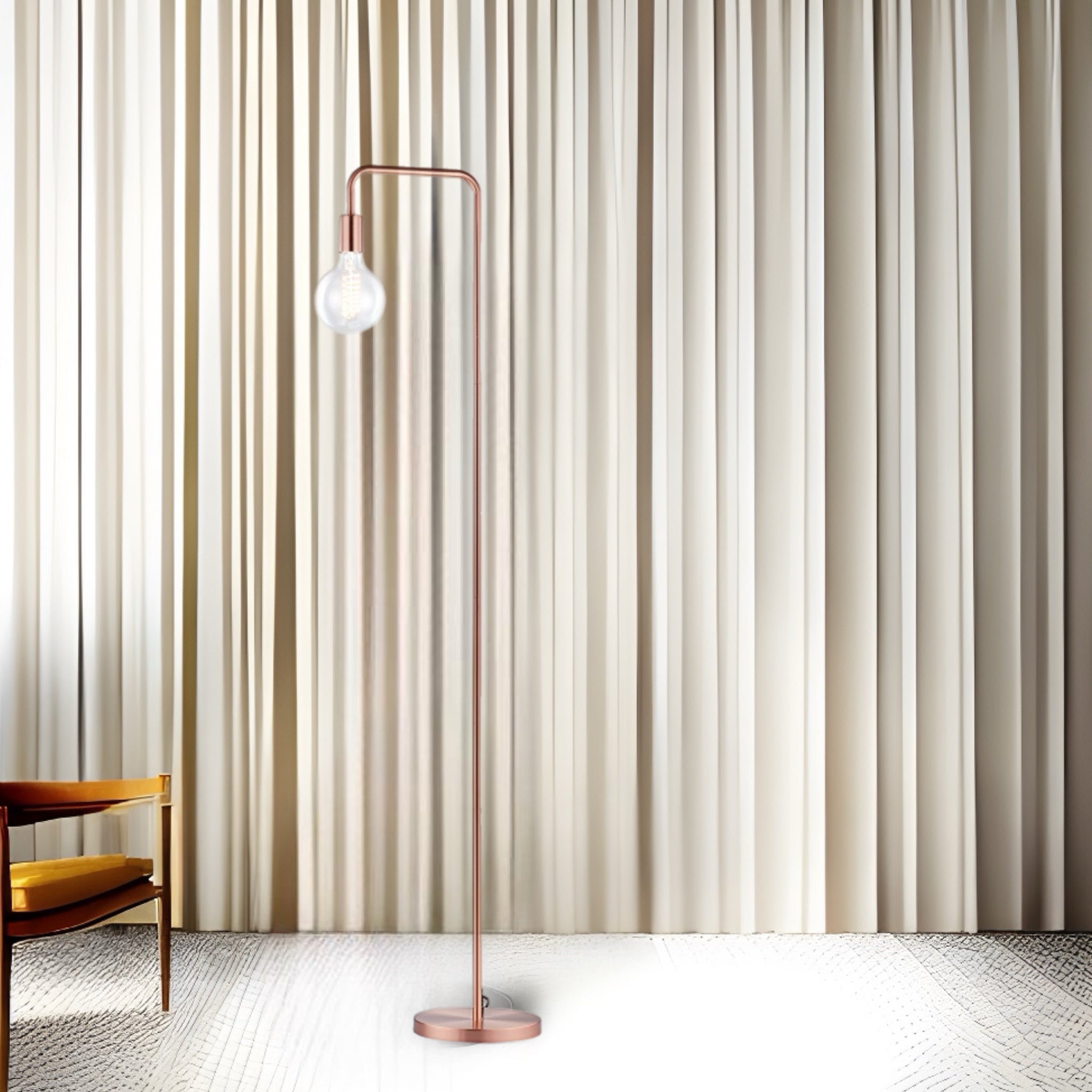 Our Caitlin floor lamp features an angular metal frame to bring a hint of industrial style to your interior. Add a filament bulb for an extra special effect. Finished in brushed copper.