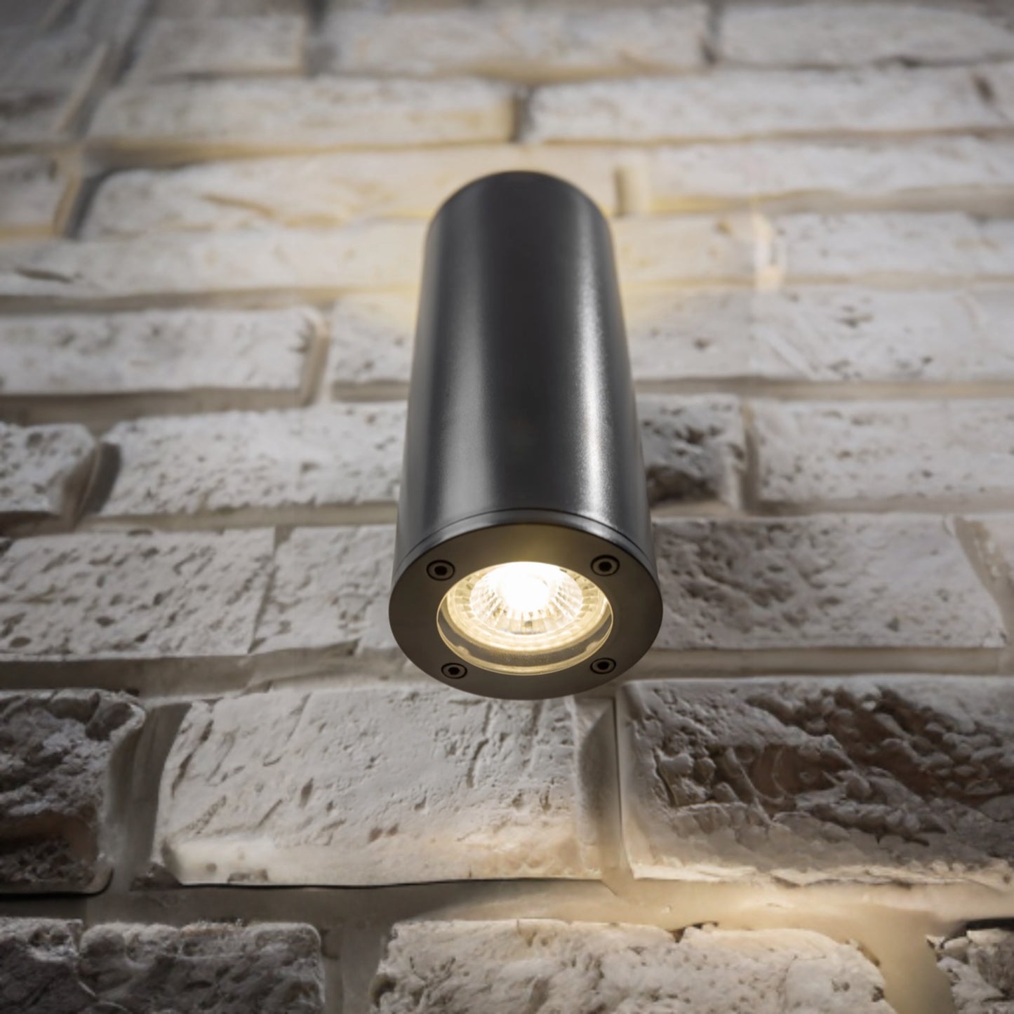 Our Sherri dark grey cylinder up and down wall light would look perfect in a modern or more traditional home design. Outside lights can provide atmospheric light in your garden, at the front door or on the terrace as well as a great security solution. It is designed for durability and longevity with its robust material producing a fully weatherproof and water resistant light fitting