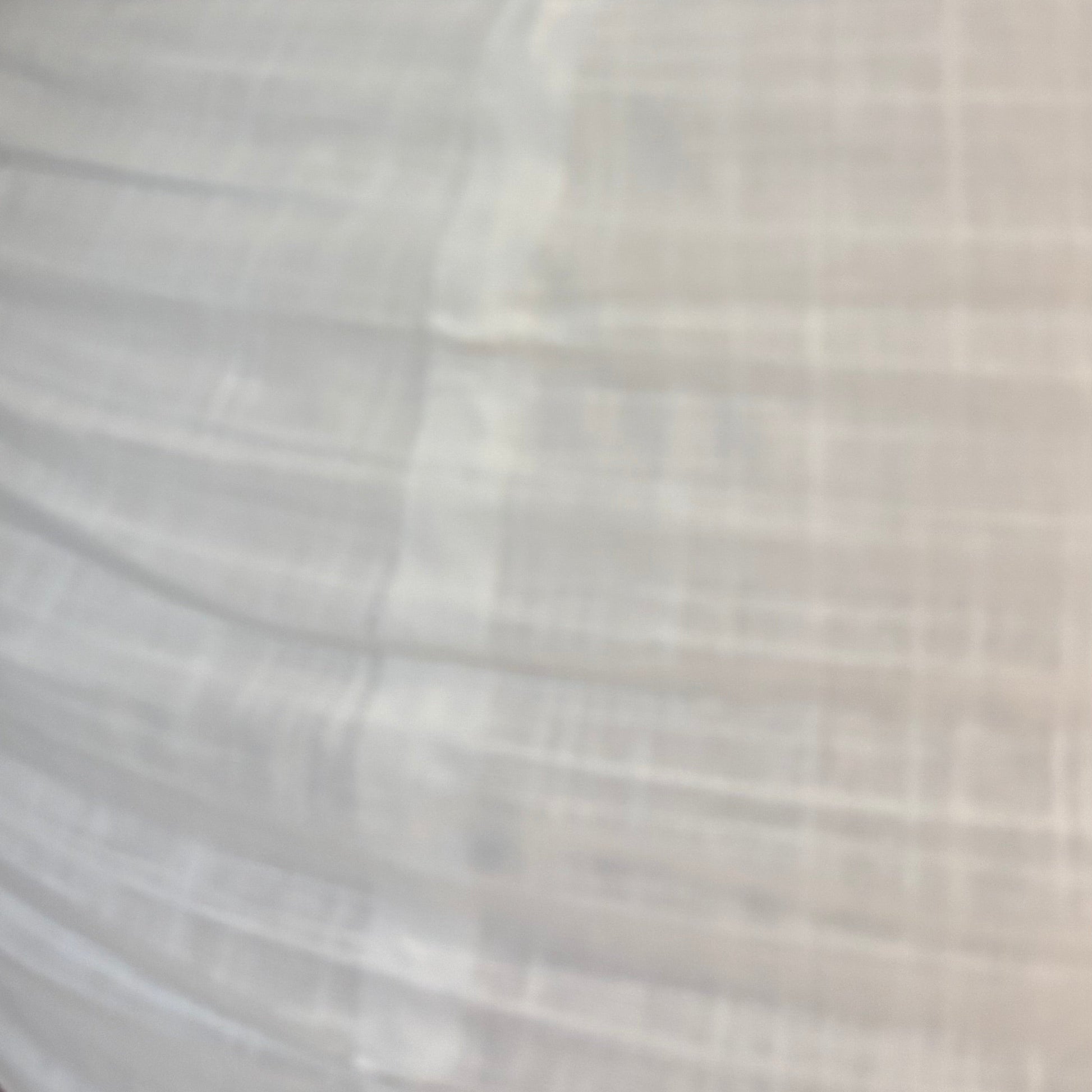 Close-up of a textured fabric with a subtle pattern