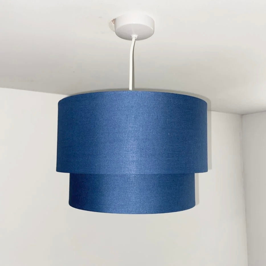 Our Kimber easy fit two tiered luxury fabric double layered shade is contemporary in its appearance and we have designed the shade to suit a range of interiors. Easy to fit simply attached to an existing pendant flitting.  It is crafted from high quality fabric material in two layers and complimented with a white inner. INSTALLATION: Simply attach to your existing light fitting for an instant glow up