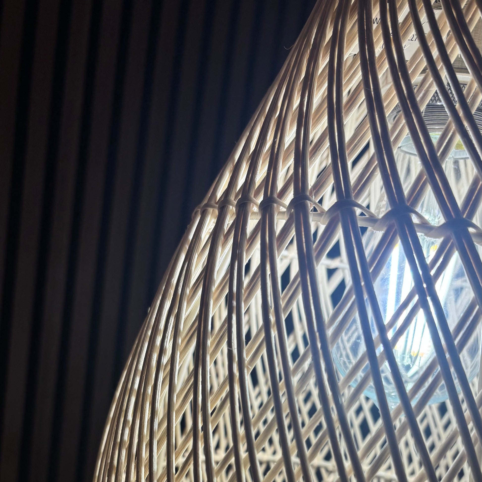 Close-up of a woven basket with a dark background