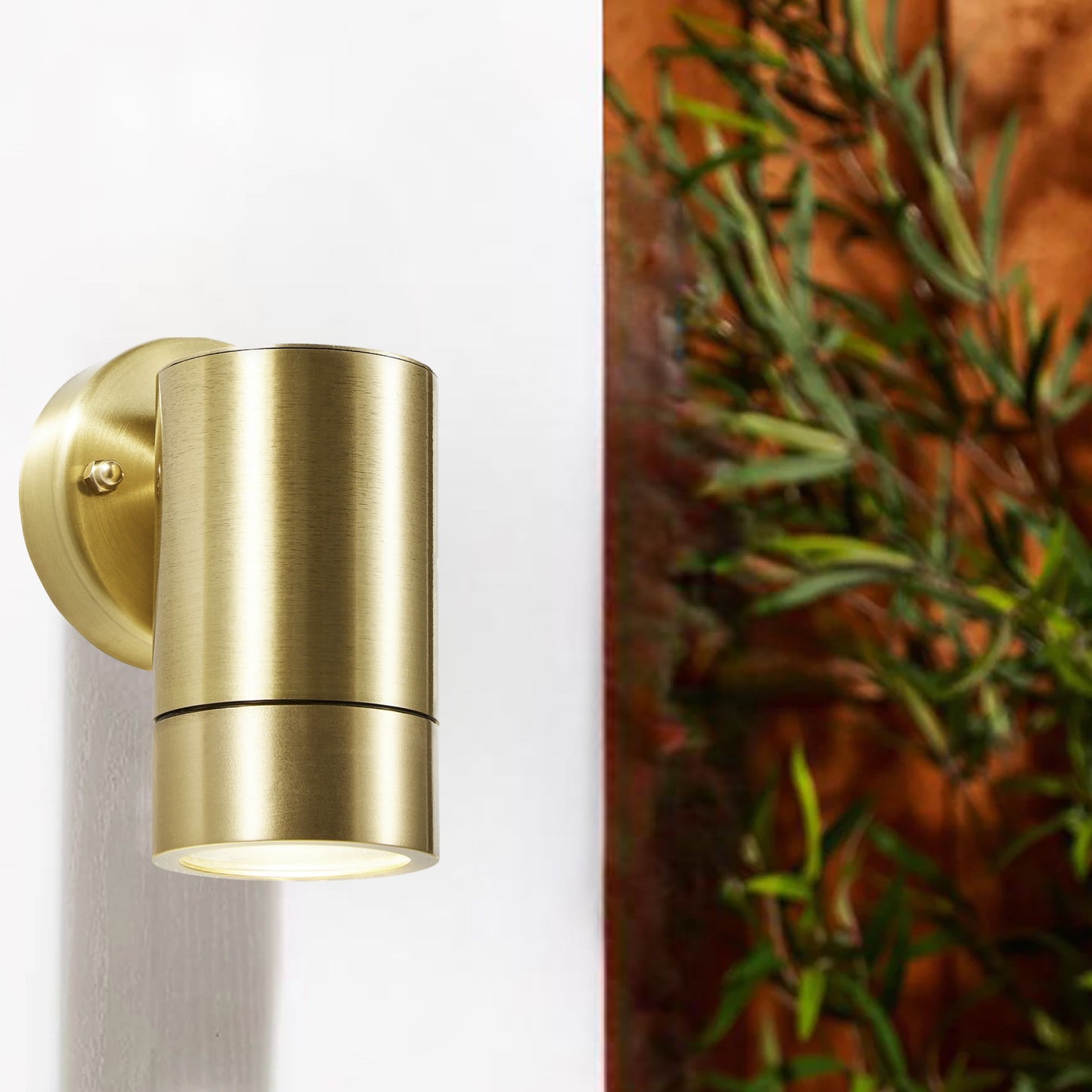 Our Noah brass outdoor wall mounted single cylinder outdoor light would look perfect in a modern or more traditional home design. Outside wall lights can provide atmospheric light in your garden, at the front door or on the terrace as well as a great security solution. It is designed for durability and longevity with its robust material producing a fully weatherproof and water-resistant light fitting. Use LED bulbs to make this light energy efficient and low cost to run.
