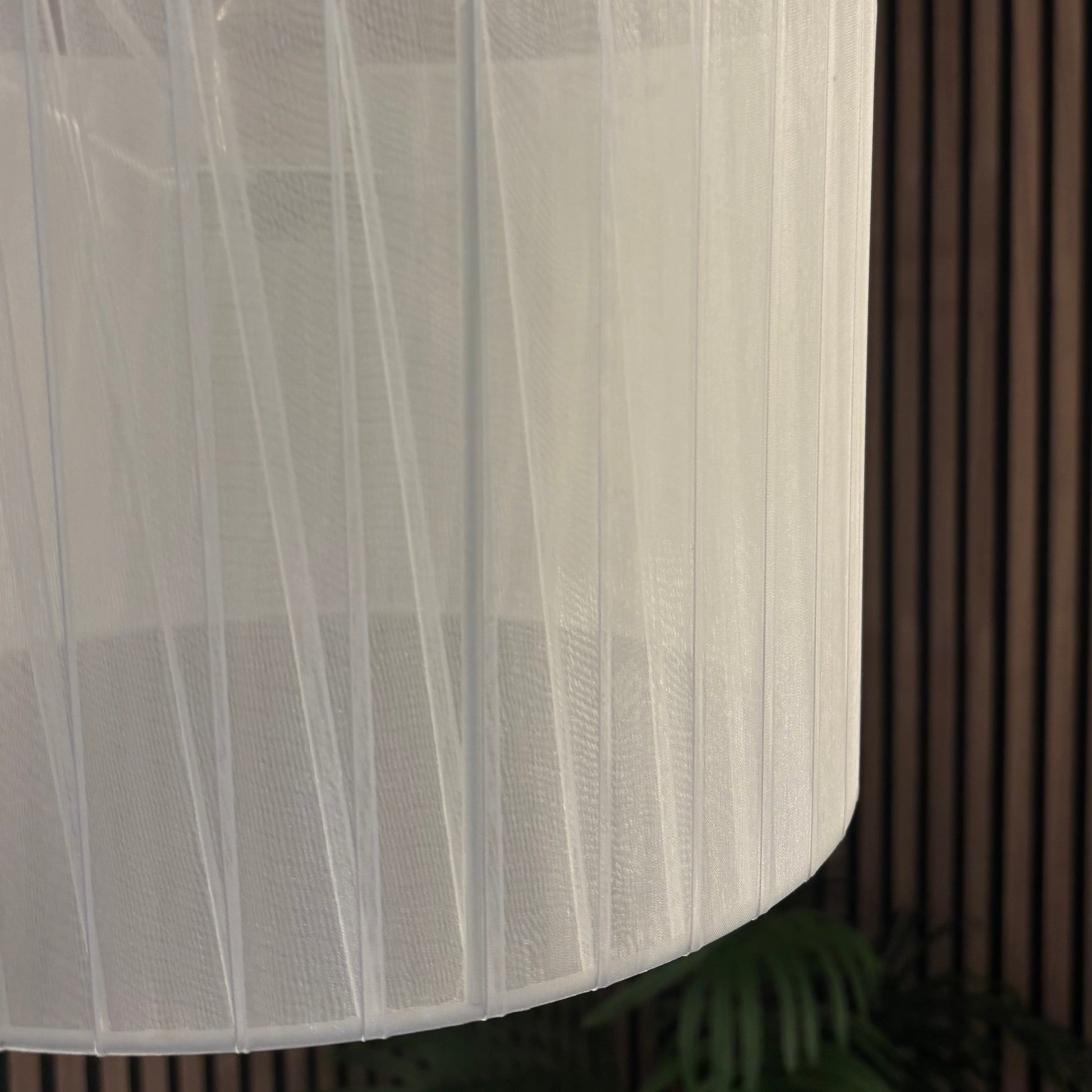White lampshade against a dark background