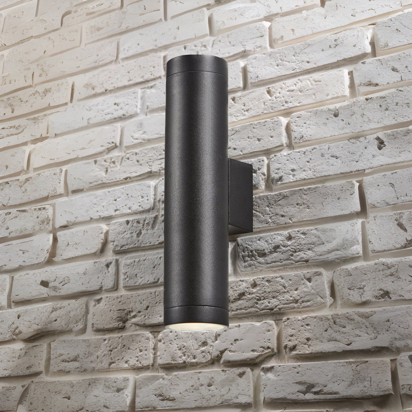 Our Lucas black extra long outdoor wall mounted up and down cylinder outdoor light would look perfect in a modern or more traditional home design. Outside wall lights can provide atmospheric light in your garden, at the front door or on the terrace as well as a great security solution. It is designed for durability and longevity with its robust material producing a fully weatherproof and water resistant light fitting.