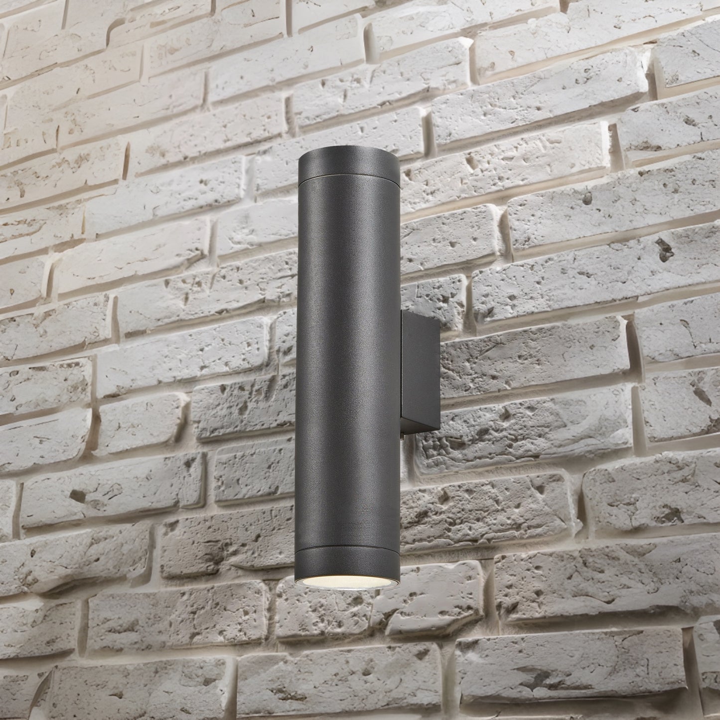 Our Lucas grey anthracite extra long outdoor wall mounted up and down cylinder outdoor light would look perfect in a modern or more traditional home design. Outside wall lights can provide atmospheric light in your garden, at the front door or on the terrace as well as a great security solution. It is designed for durability and longevity with its robust material producing a fully weatherproof and water resistant light fitting.