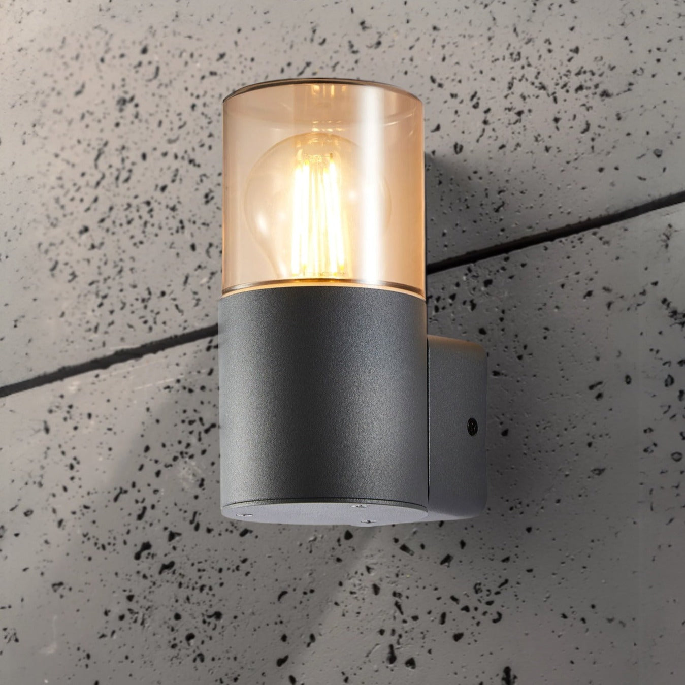 Our Levi grey anthracite outdoor wall light with smoked diffuser would look perfect in a modern or more traditional home design. Outside wall lights can provide atmospheric light in your garden, at the front door or on the terrace as well as a great security solution. It is designed for durability and longevity with its robust material producing a fully weatherproof and water resistant light fitting.
